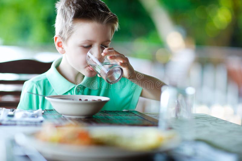 Little boy drinking water stock image. Image of portrait 24343705