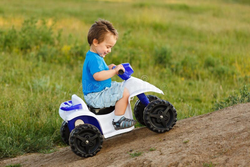 Boy Driving Toy Quad on Terrain Stock Image Image of tiny, plastic