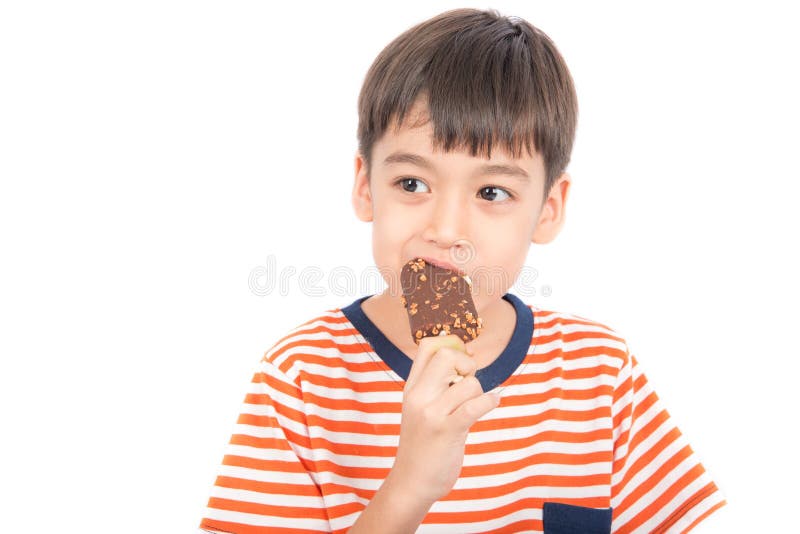 Little boy eating chocolate icecream with happy face summer time