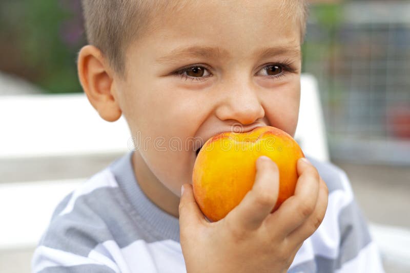 Little Boy Eating Fresh Fruit Stock Photo Image of outdoors, ripeness