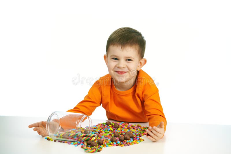 Little boy eating sweets stock photos Little boy eating sweets stock photos