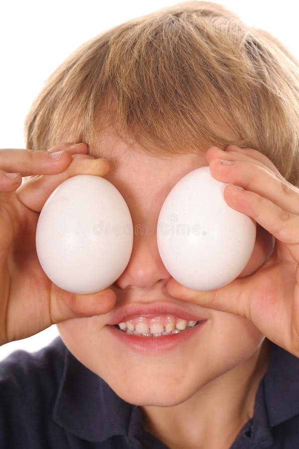 Little boy with egg eyes vertical