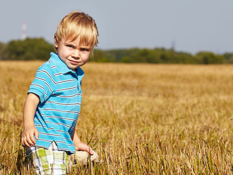 Little boy on a field stock image. Image of male, playing - 32870991