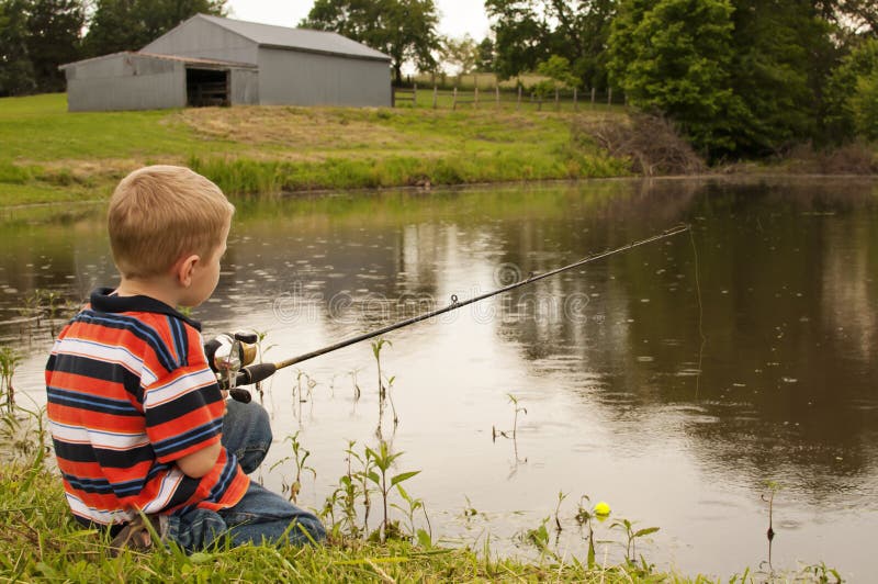 Little boy fishing in pond stock photo. Image of barn - 61645058