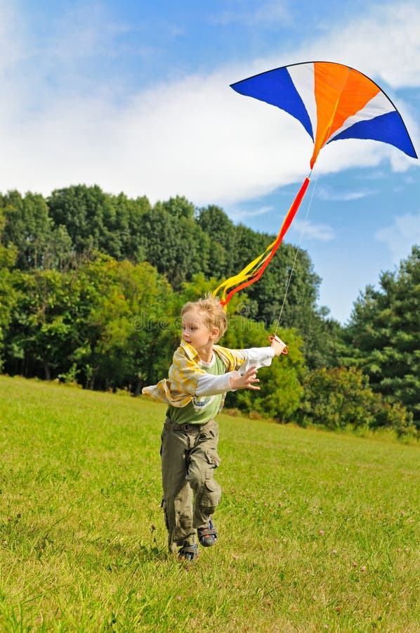 Little boy flying a kite stock image. Image of action 16306569