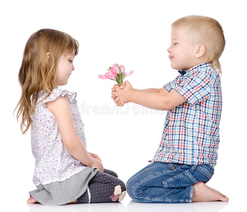 The little boy gives to the girl a flower. isolated on white