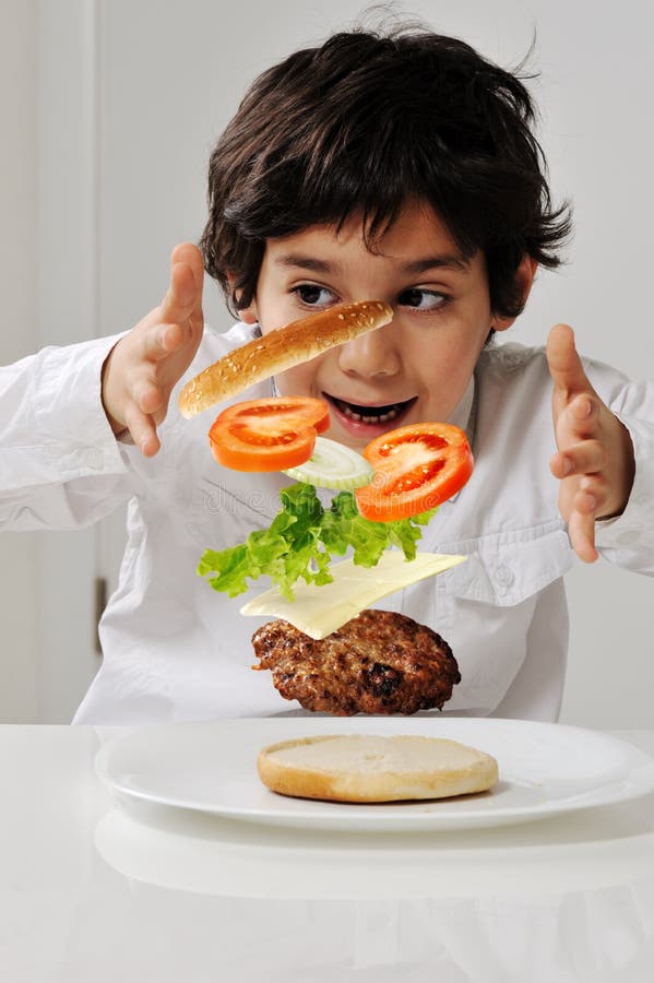Little boy with hamburger royalty free stock image Little boy with hamburger royalty free stock image