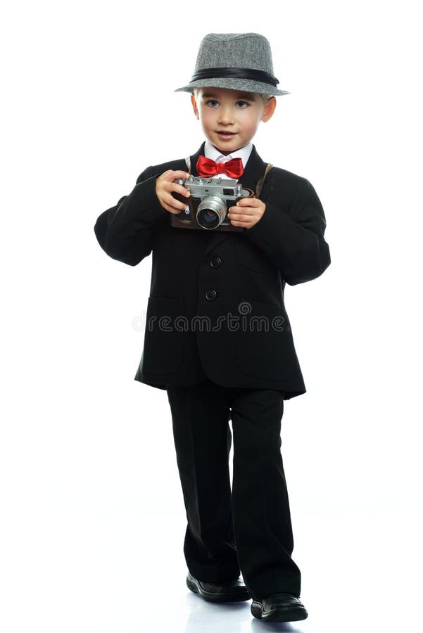 Little boy in hat and black suit