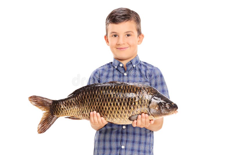 Little boy holding a big fish