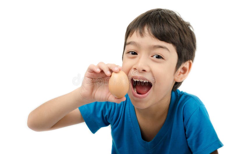 Little boy holding egg in hand healthy on white background
