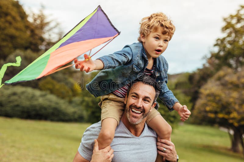 Happy father and son flying kite outdoors royalty free stock image Happy father and son flying kite outdoors royalty free stock image