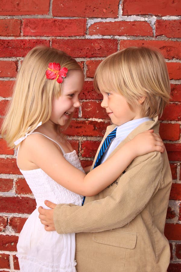 Little boy hugging a pretty girl. Love concept