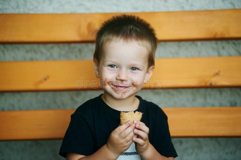 9. Little boy with blonde hair and messy face from eating ice cream - wide 8