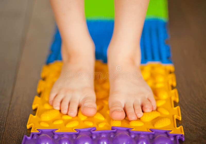 Little Boy Kid Walking on a Orthopedic Massage Mat. Treatment and  Prevention of Flat Feet in Children Stock Photo - Image of care, cute:  179307106