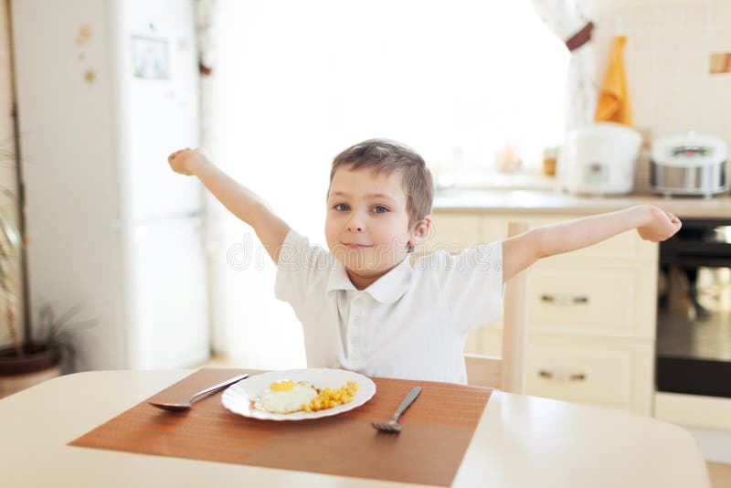 Little boy in the kitchen stock image. Image of light 58424279