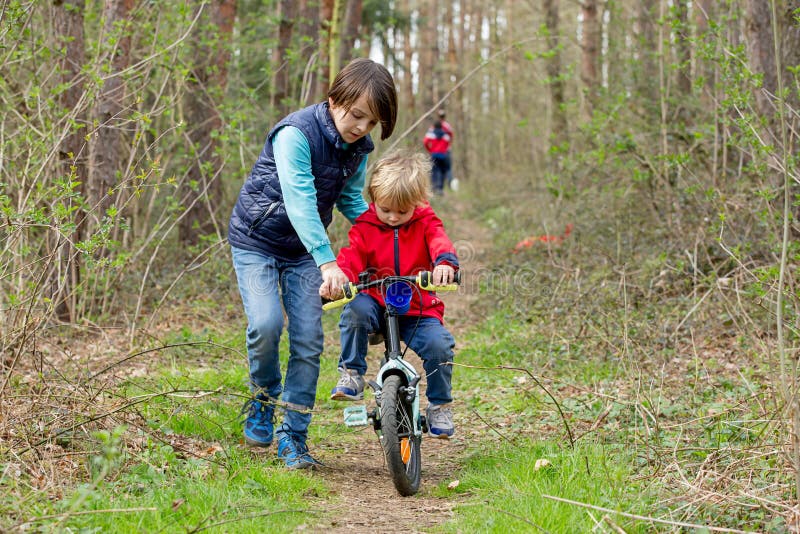 Little Boy, Learning How To Ride A Bike In The Park Stock Image Image