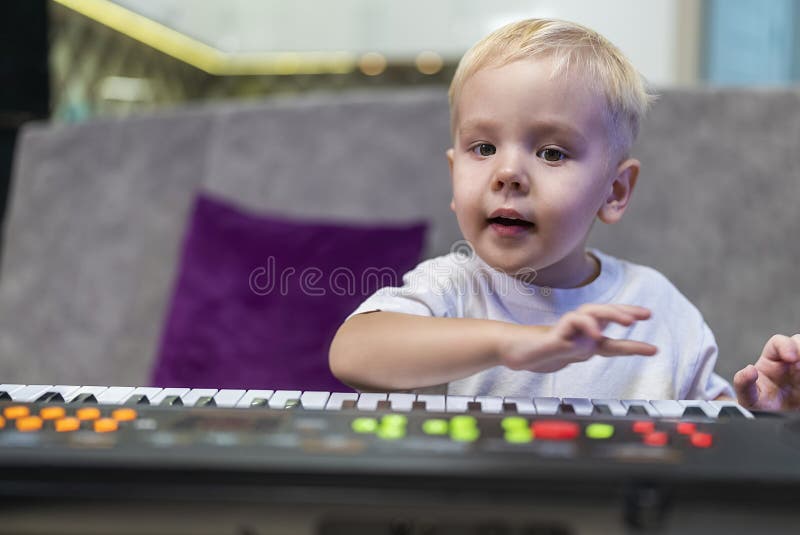 Little Boy Learning To Play the Piano at Home Stock Photo Image of