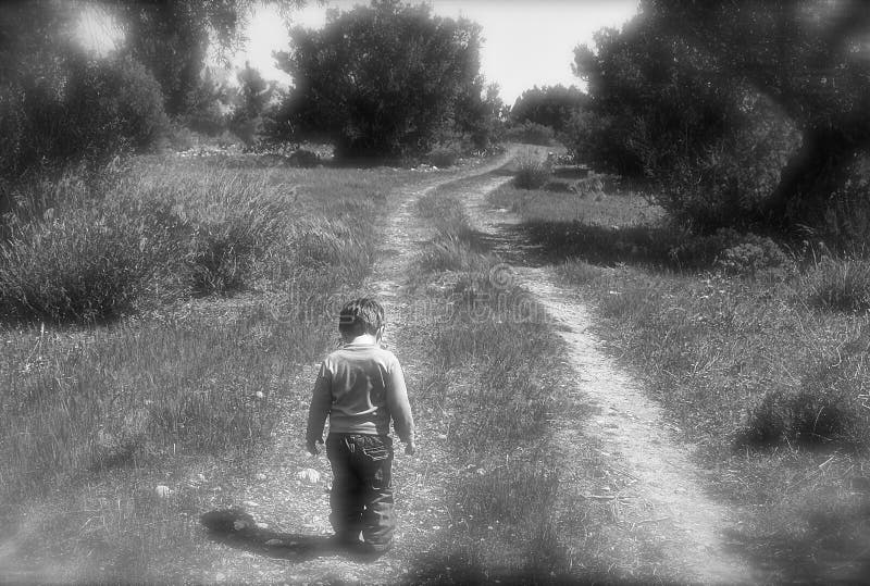 Little boy learning to walk on sunny day, taking the first steps