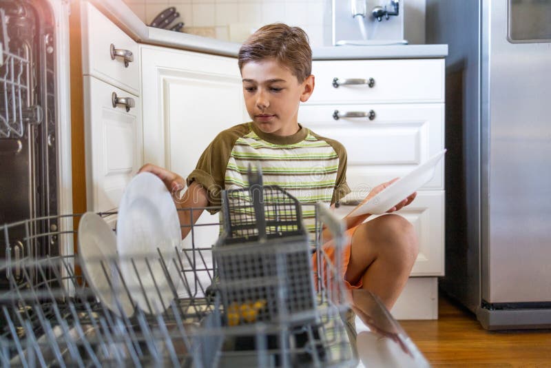 Kids Loading Dishwasher Stock Photos - Free & Royalty-Free Stock Photos  from Dreamstime