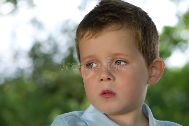 Little Boy Looking To His Right in Countryside Stock Image - Image of ...