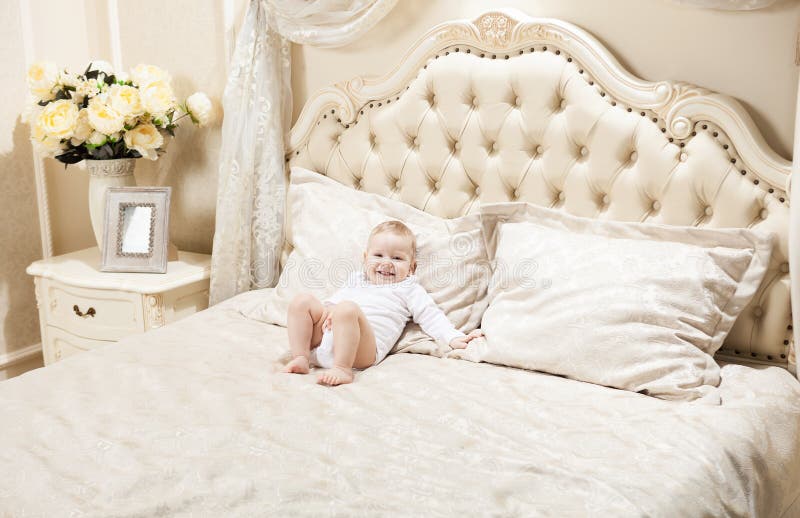 Little boy lying on bed at home