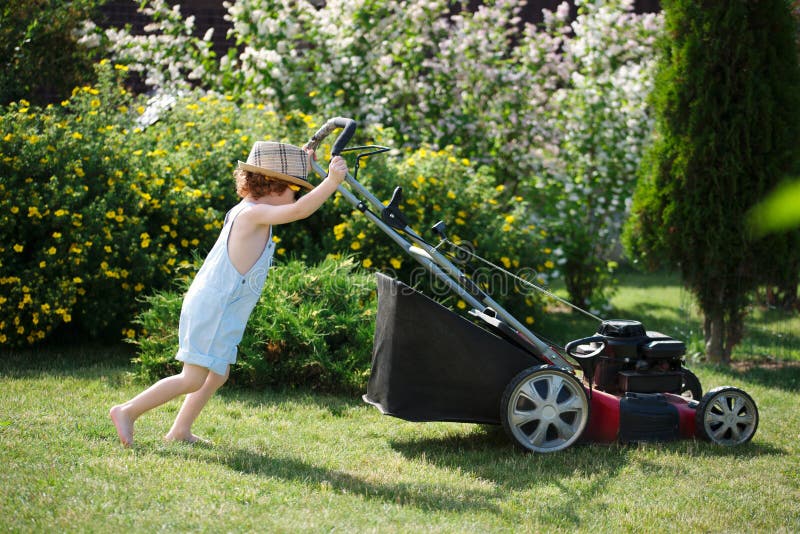 Little Boy Mows Lawn with Mower Stock Image Image of happiness