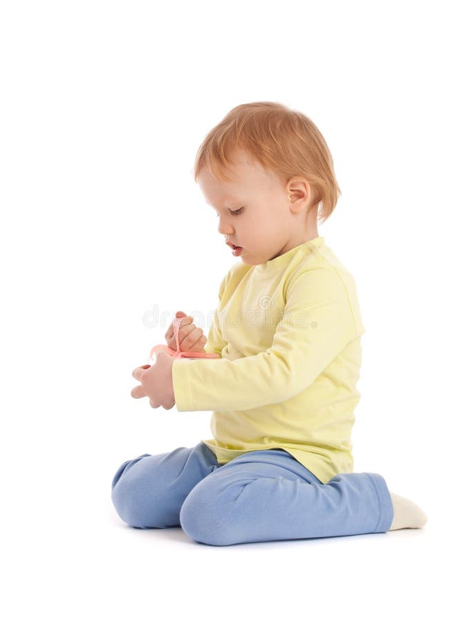 Little boy open small pink gift box royalty free stock images