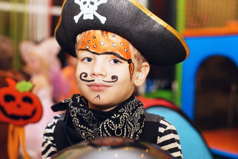 Little Boy in a Pirate Costume and a Makeup on His Face is Having a Good Time the Halloween Party Stock Photo - Image of beautiful, halloween: 101157624