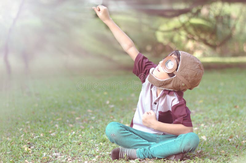 Little boy play as pilot in the park vintage color