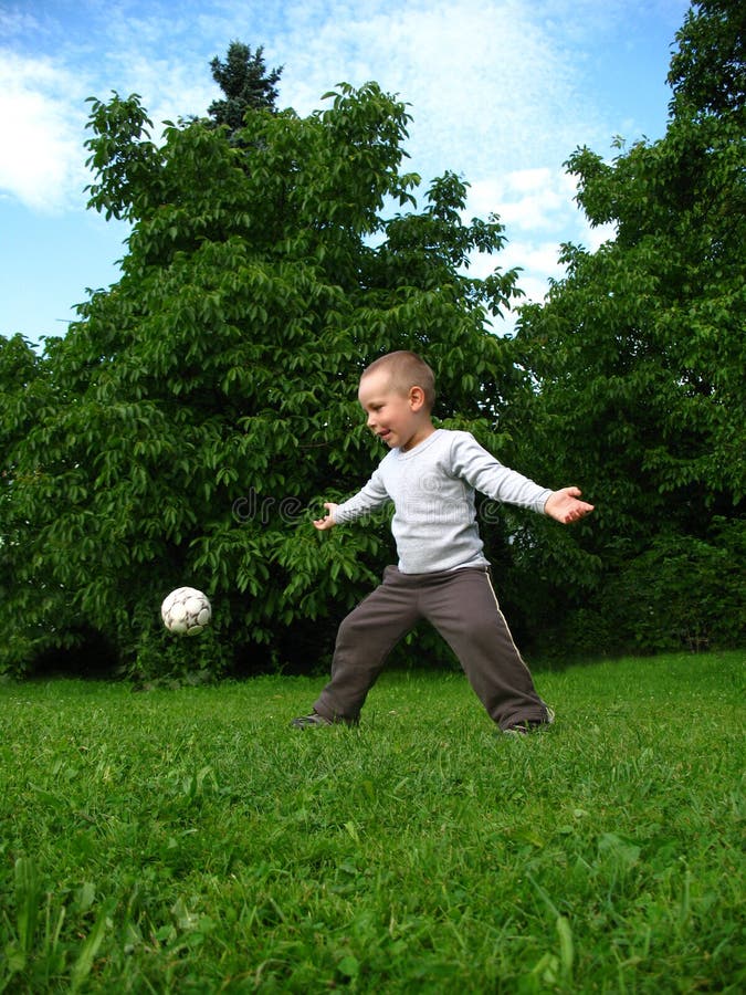 Little boy play football