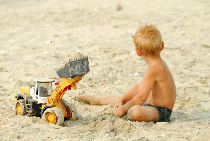 Little boy play on thÑƒ beach
