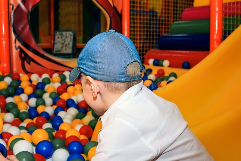 Little Boy Playing with Balls Stock Image Image of laughing, ground