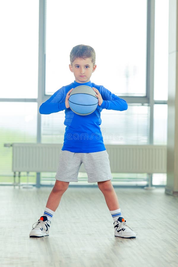 Little Boy Playing Basketball Blue Ball and Form Stock Photo Image of
