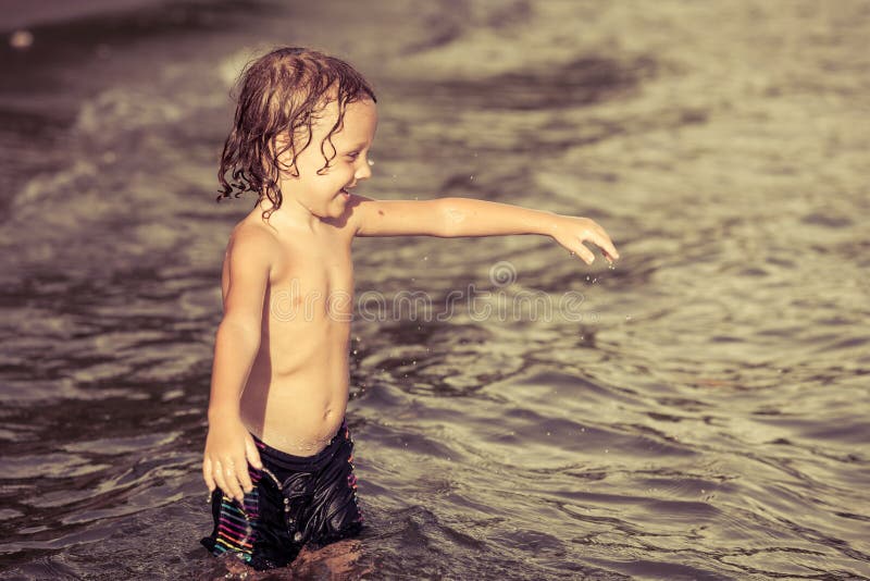 Little boy playing on the beach