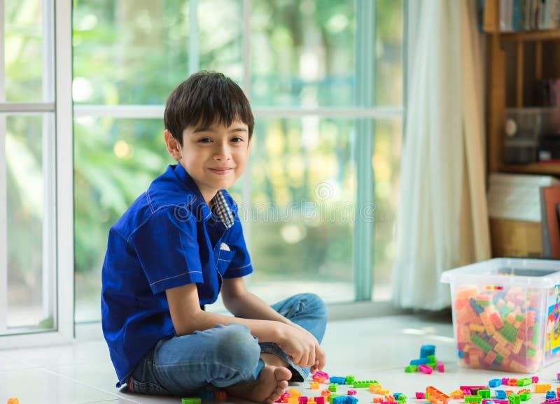 Little boy playing block indoor house