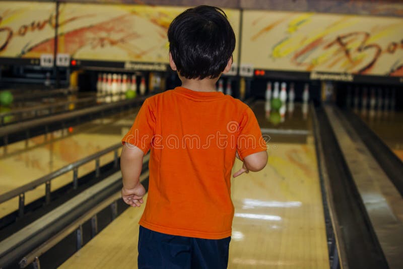 Cute boy with bowling ball stock photo. Image of eurasian 9199552