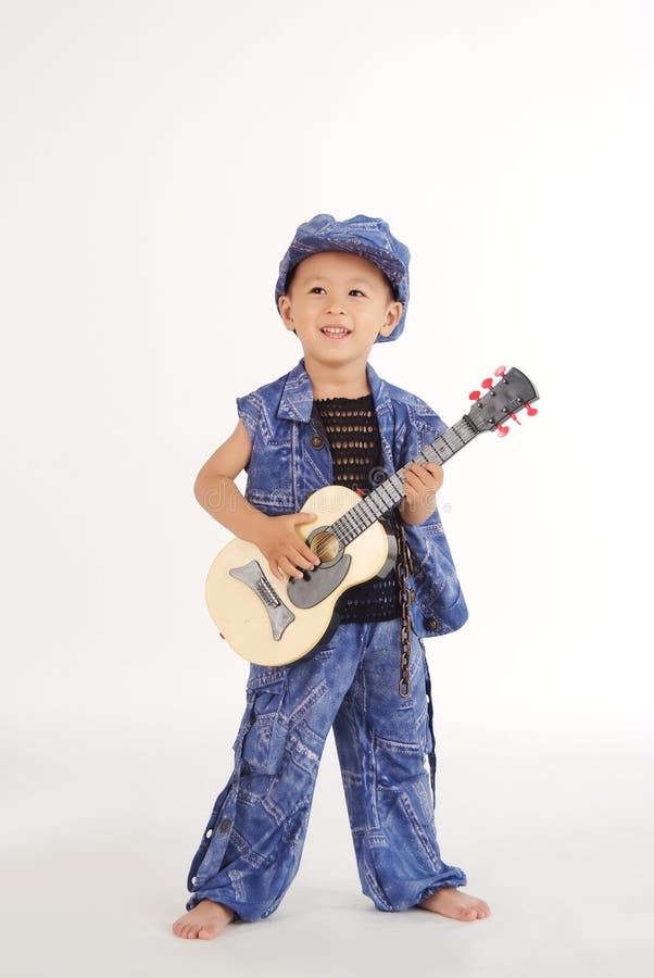 Little boy is playing guitar