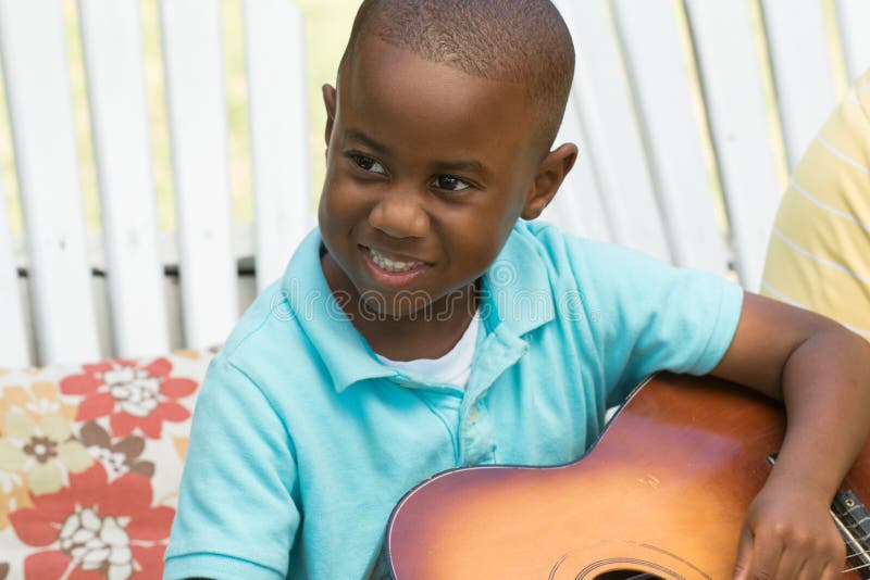 Little boy playing the guitar. royalty free stock photo Little boy playing the guitar. royalty free stock photo