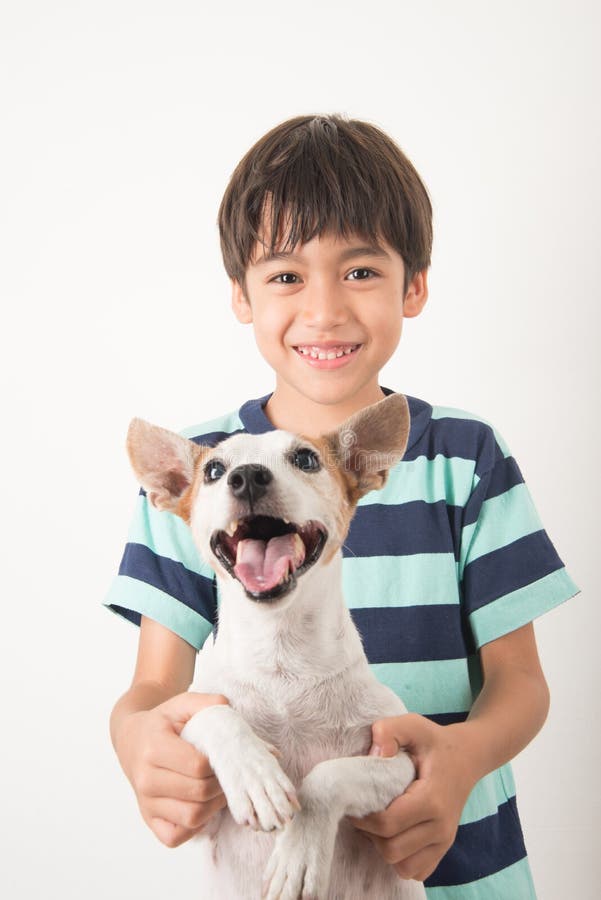 Little boy playing with his friend dog jack russel on white stock photo Little boy playing with his friend dog jack russel on white stock photo