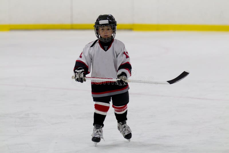 Child Skating with a Puck at Ice Hockey Practice Stock Photo Image of