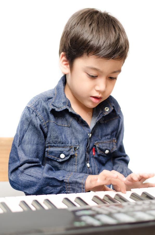 Little boy playing keyboard