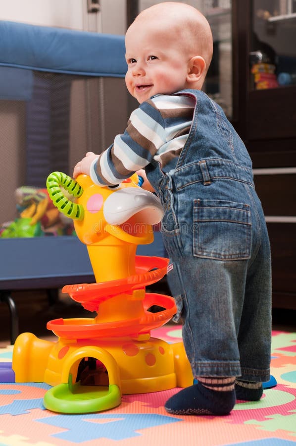 Little boy is playing with toy