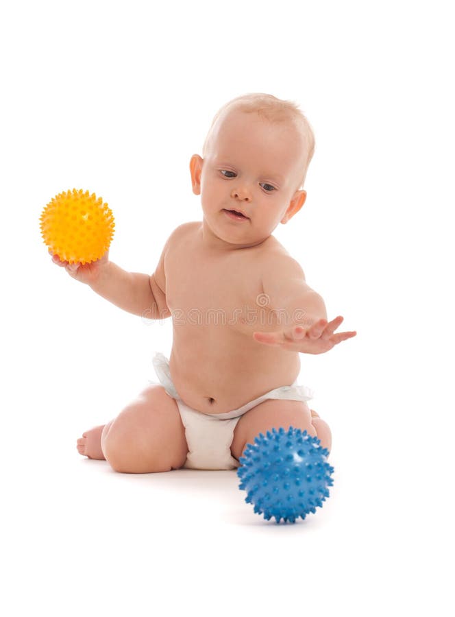 Little boy playing with two massage balls