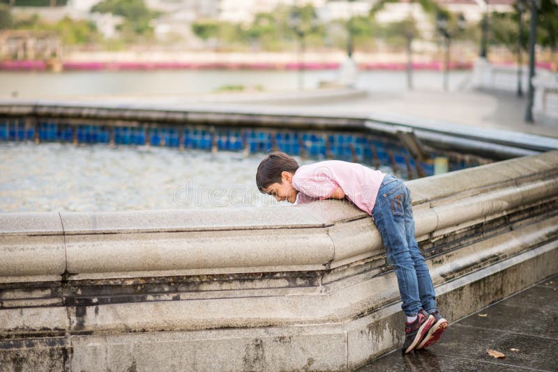 Little boy playing water over fountain outdoor royalty free stock images Little boy playing water over fountain outdoor royalty free stock images