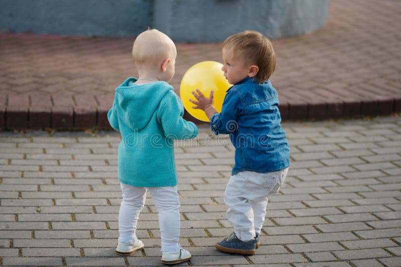 Little boy playing with yellow ball royalty free stock photo Little boy playing with yellow ball royalty free stock photo