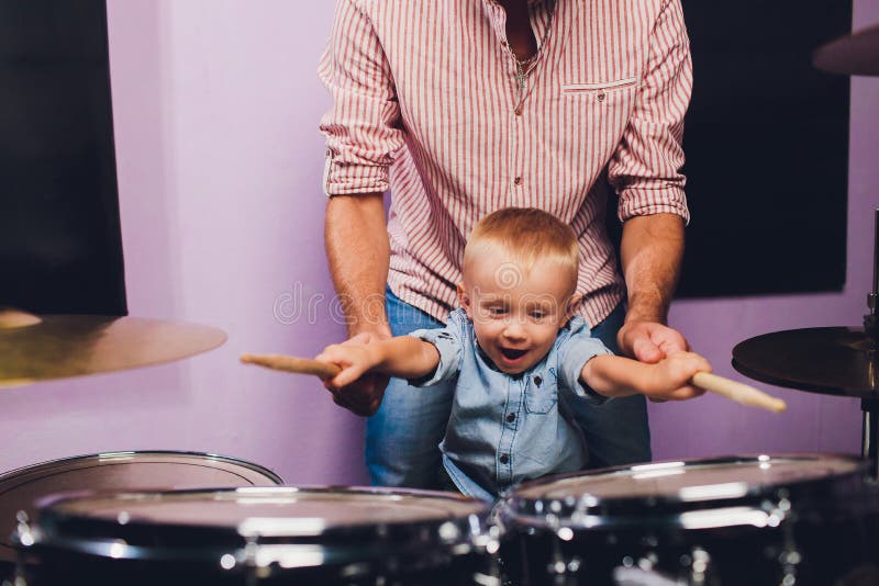 Little Boy Plays Drums in Recording Studio. Stock Photo Image of