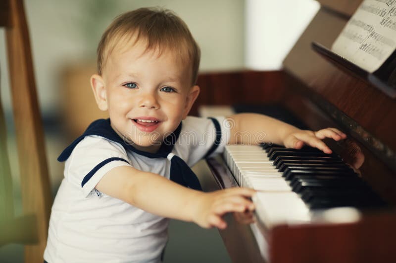 Little boy plays piano