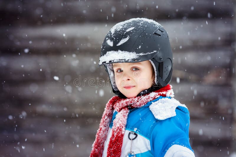 Little boy portrait with helmet at winter holiday