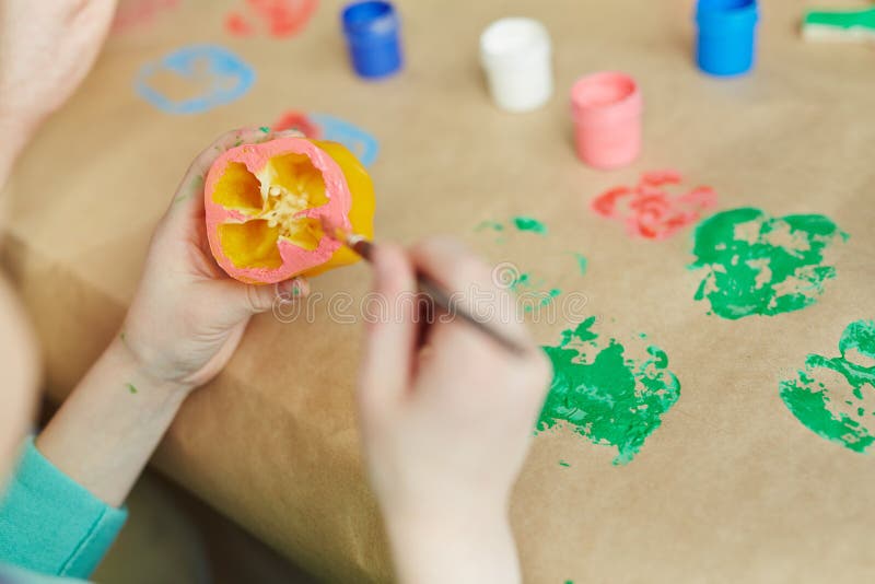 Little boy practicing vegetable printing