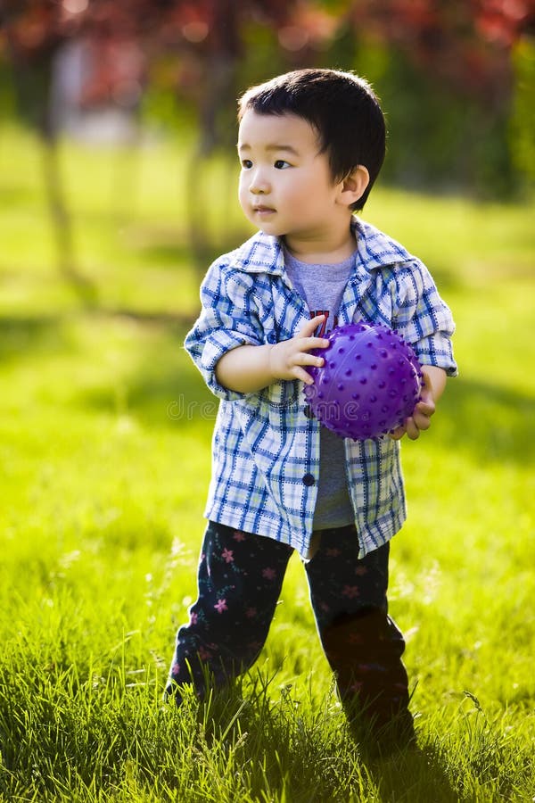 Little boy with purple ball